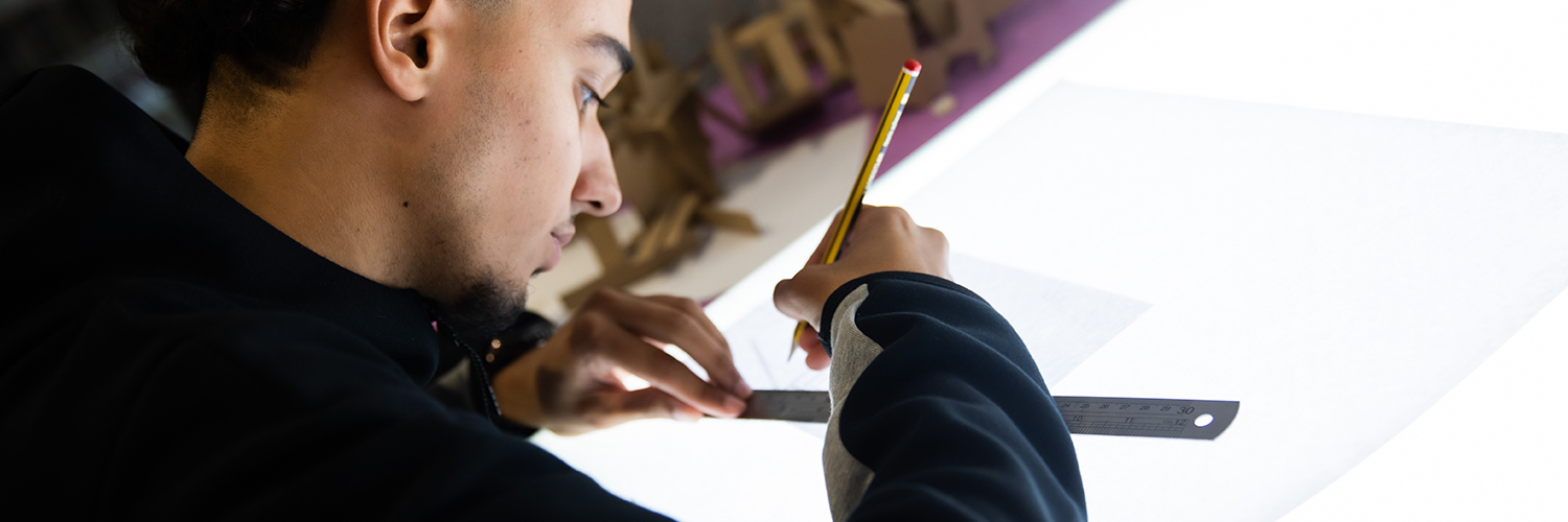 Student working with an architecture lightbox