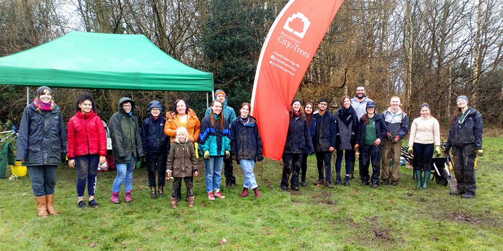Group of people with City of Trees banner