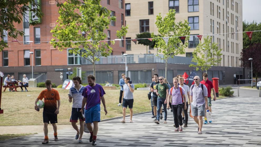 Potential students exploring the University of Salford campus.