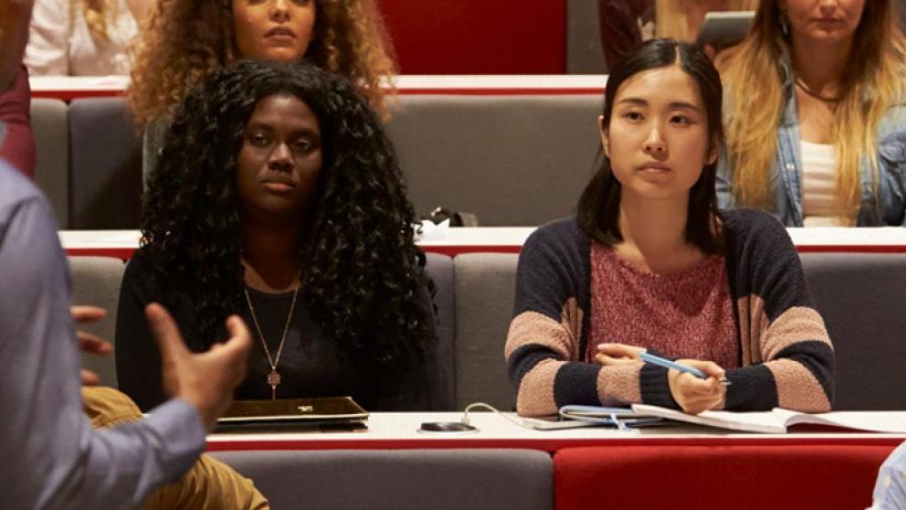 A lecturer presents to a group of students