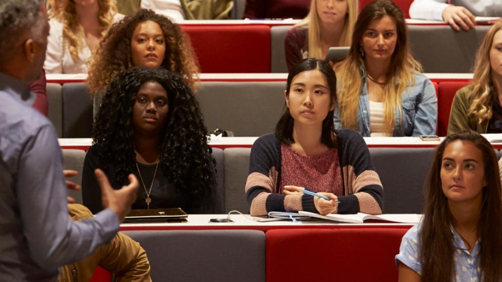 A lecturer presents to a group of students
