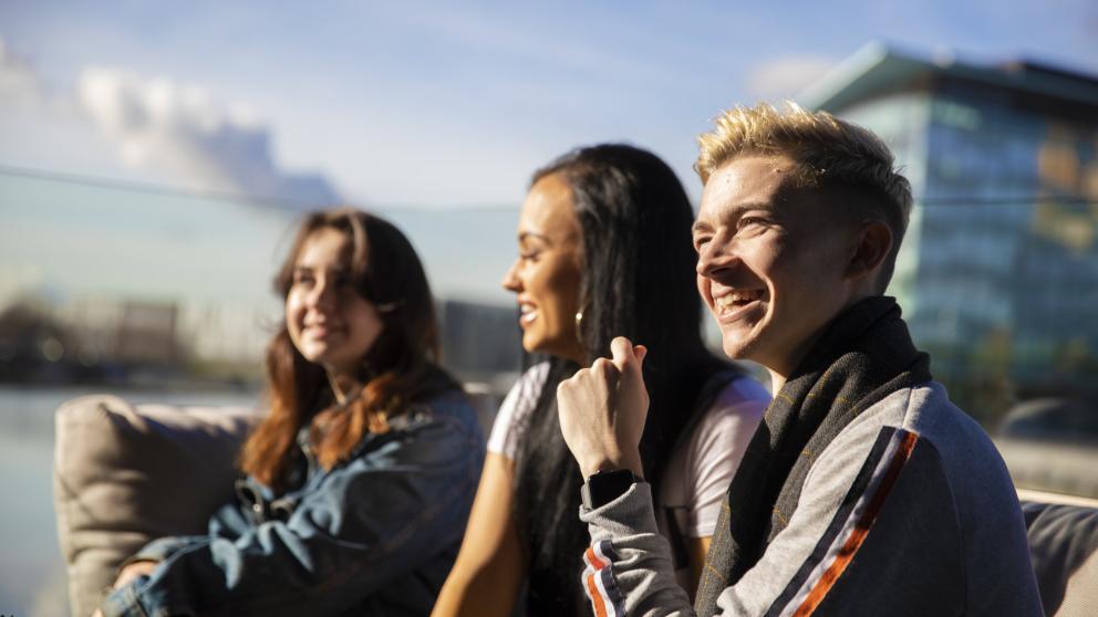 Students sat on the terrace of The Alchemist, Salford Quays