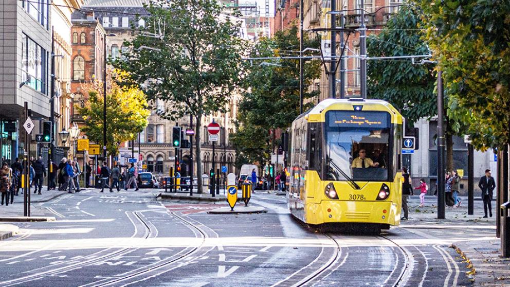 Tram travelling through Manchester city centre