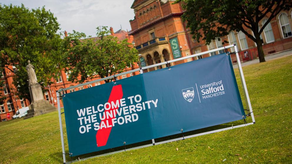 Welcome to the University of Salford signage on campus
