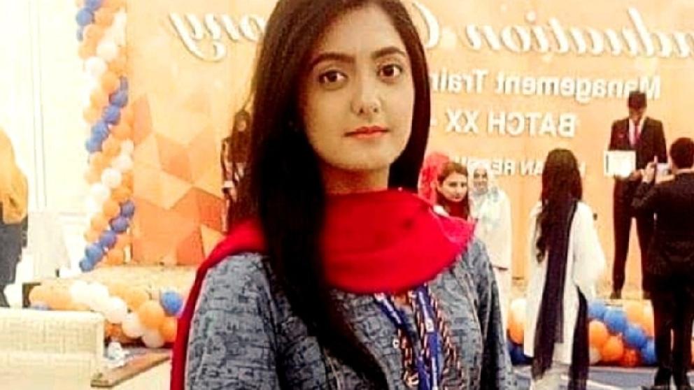 A female student at a Pakistani wedding looking into camera