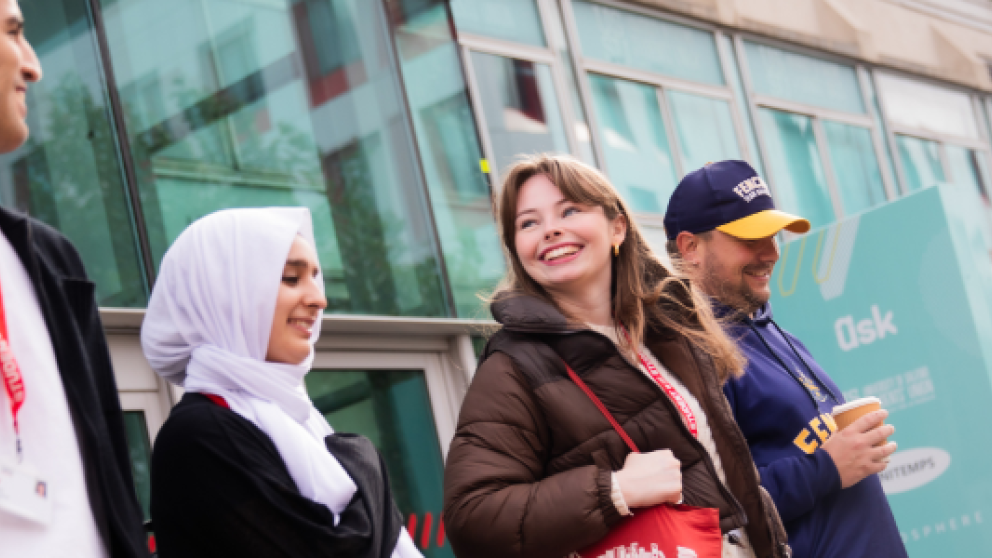 Four students leaving University House, University of Salford
