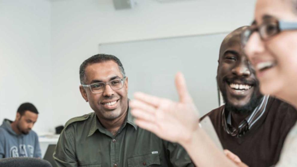 Postgraduate students talking