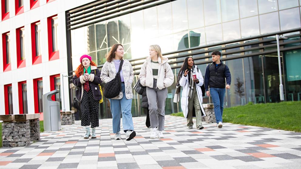 A group of students outside the Science, Engineering & Environment (SEE) Building