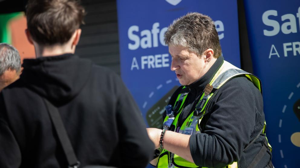 Security team explaining the Safezone app to students during Welcome Week