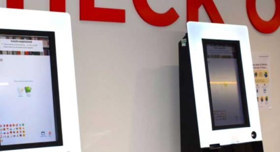 The self check out machines on the ground floor of the Clifford Whitworth Library