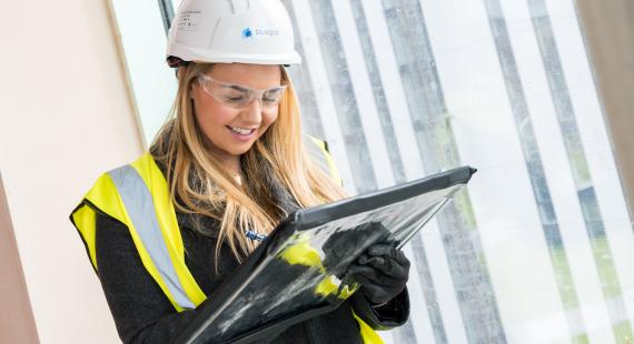 MBA construction apprentice taking notes