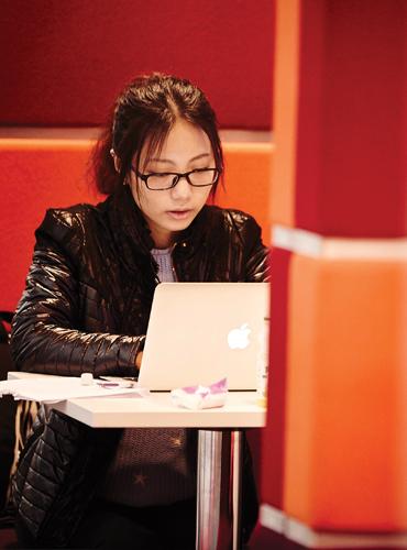 Student studying on their MAC laptop