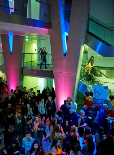 A crowd of people attending an industry event in the New Adelphi, University of Salford