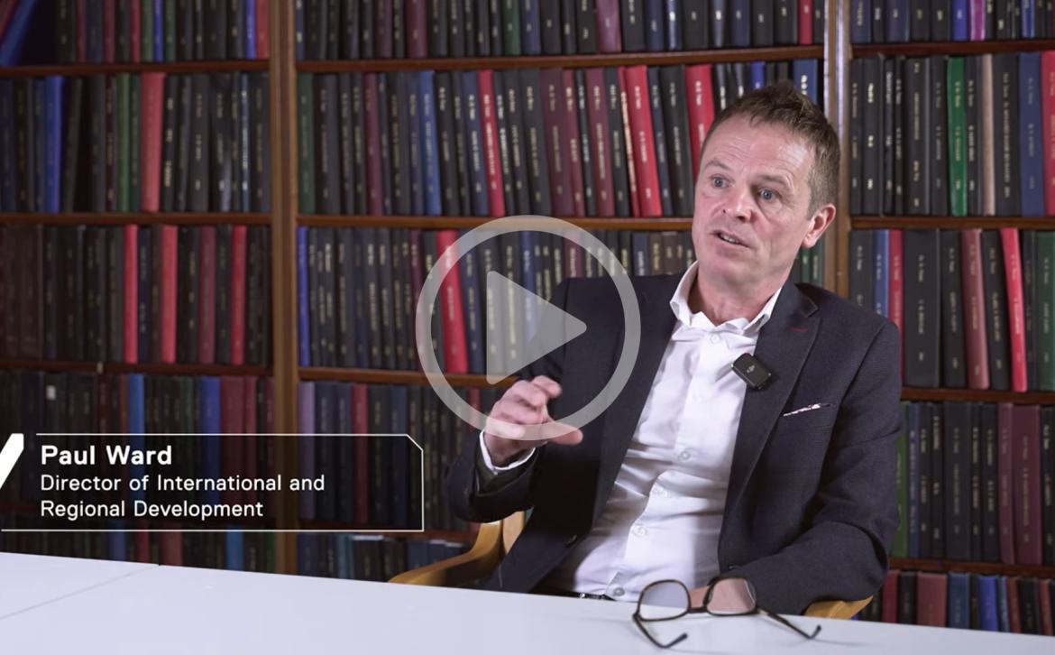 Video screenshot featuring Paul Ward, Director of International and Regional Development